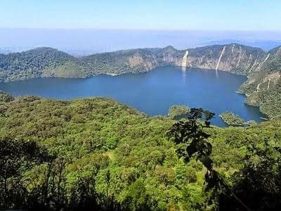 Lake surrounded by forested hills